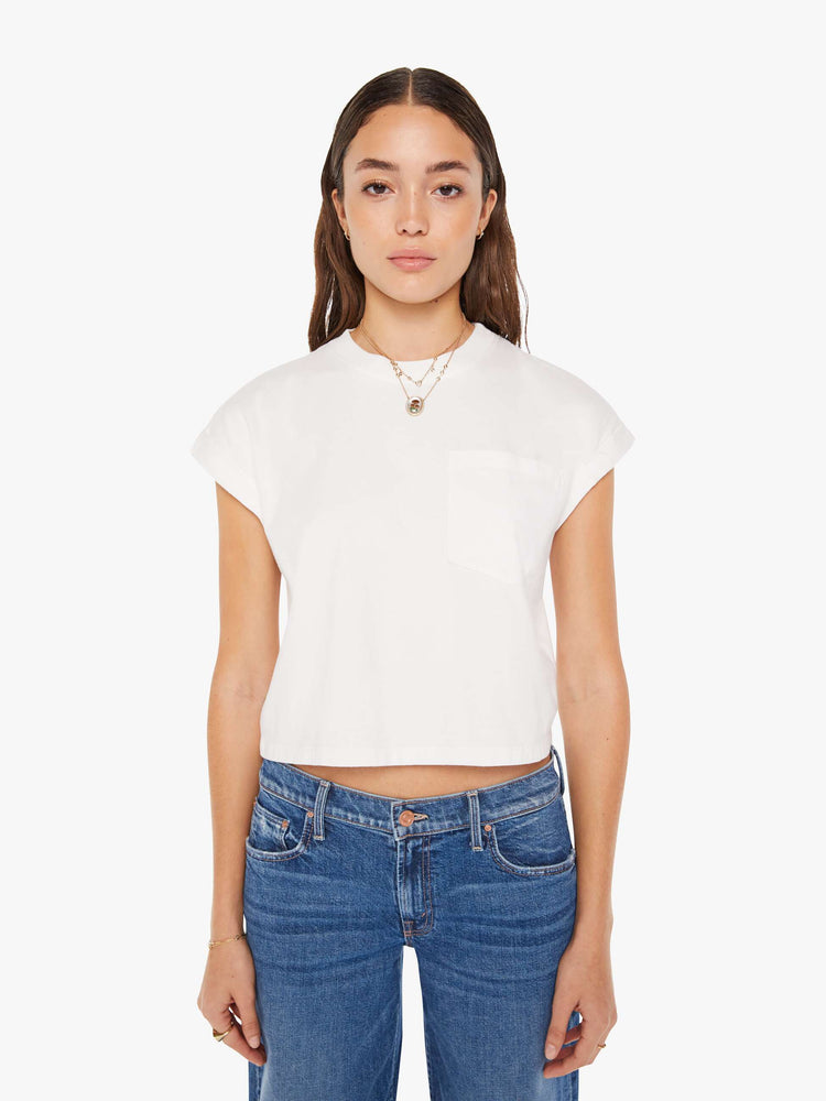 Front view of a womens white crew neck tee featuring a cropped body and chest pocket.