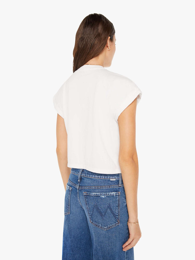 Back view of a womens white crew neck tee featuring a cropped body and chest pocket.