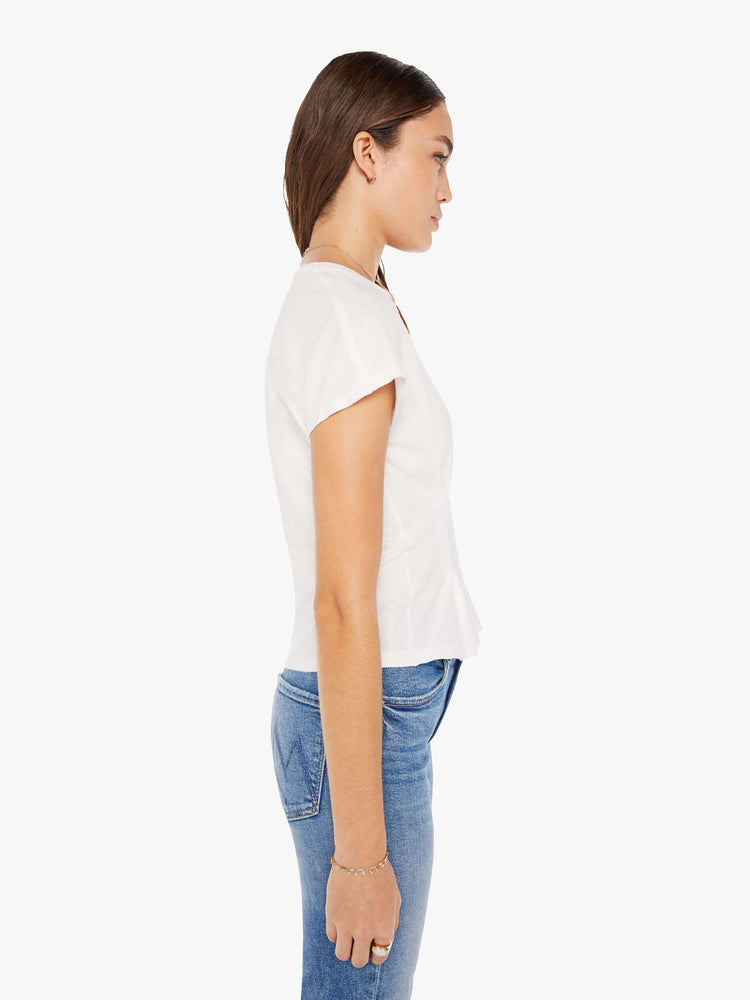 Side view of a womens white crew neck tee with pintuck details.