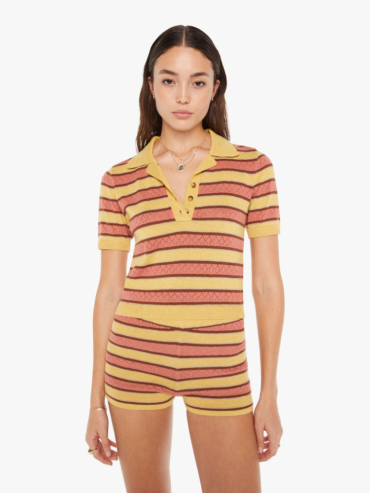 Front view of a knit top featuring a multi stripe pattern and button collar.
