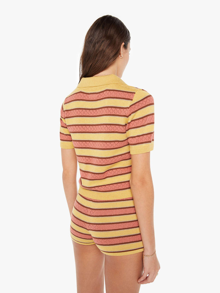 Back view of a knit top featuring a multi stripe pattern and button collar.