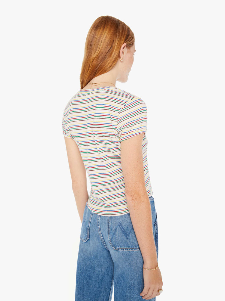 Back view of a woman baby tee with a V-neck, short sleeves and a slim fit in white with rainbow stripes throughout.