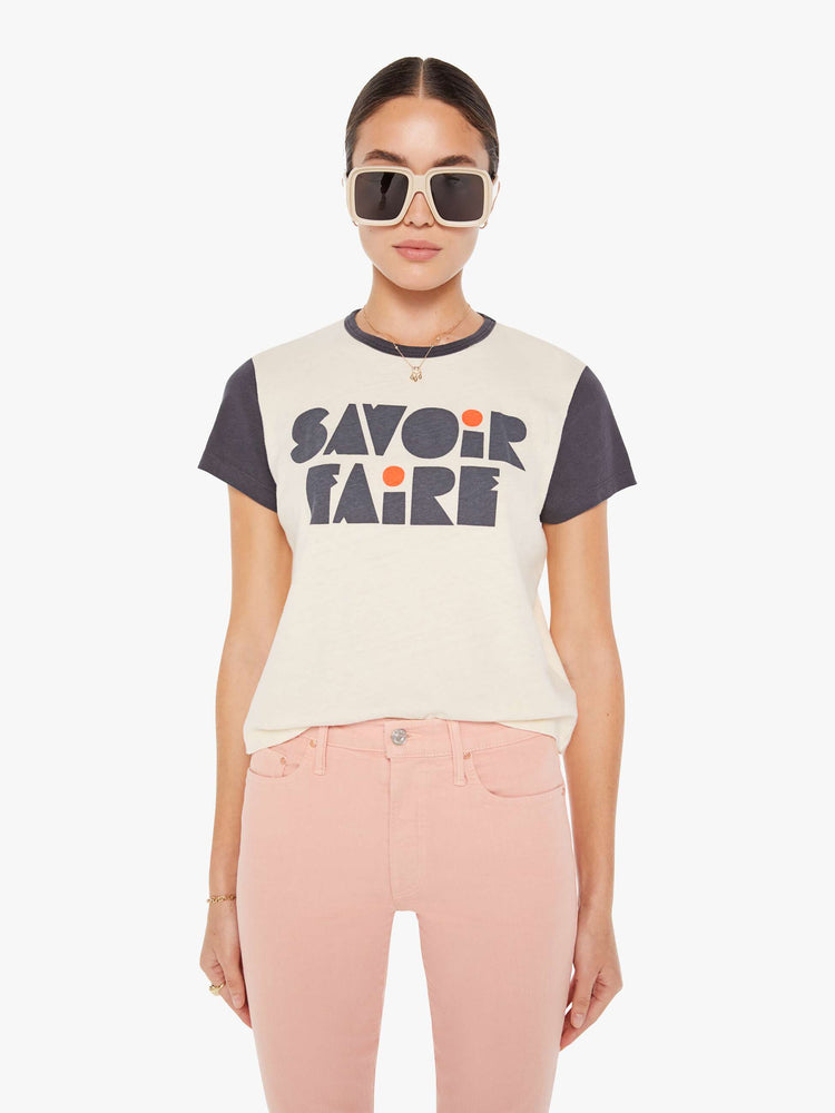 Front view of a womens black and white ringer crew neck tee featuring a front graphic that reads "SAVOIR FAIRE".