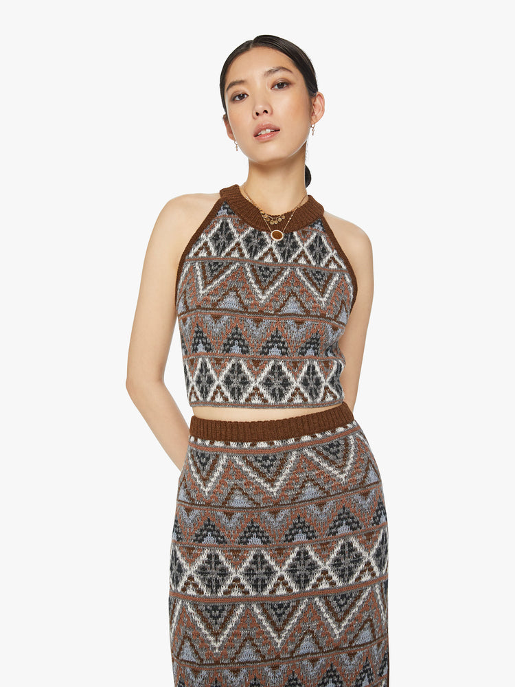 Front view of a woman knit halter top with a ribbed crew neck and a cropped hem in metallic shades of brown, grey and white.
