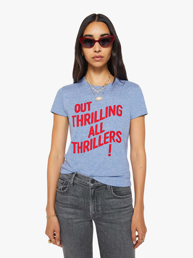Front view of a woman in a heathered blue tee features a red block text applique on the front.