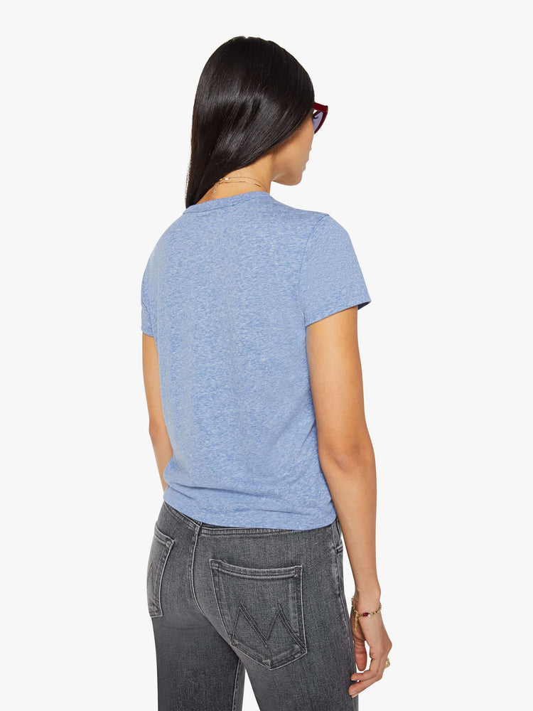 Back view of a woman in a heathered blue tee features a red block text applique on the front.