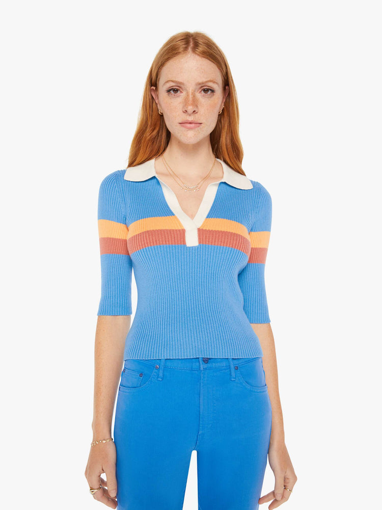 Front view of a woman blue with orange stripes collared blouse with a V-neck, elbow-length sleeves and a narrow fit.
