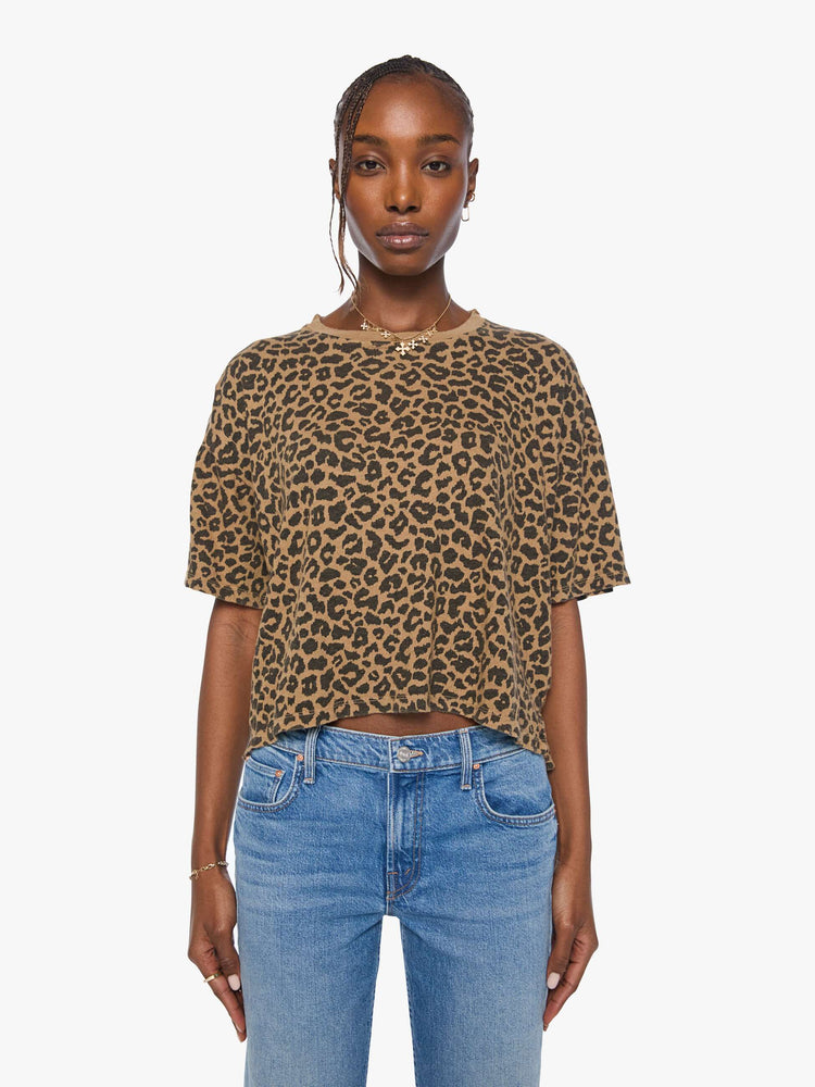 Front view of a woman in cheetah cropped crew neck tee with drop shoulders, short sleeves and a boxy fit.