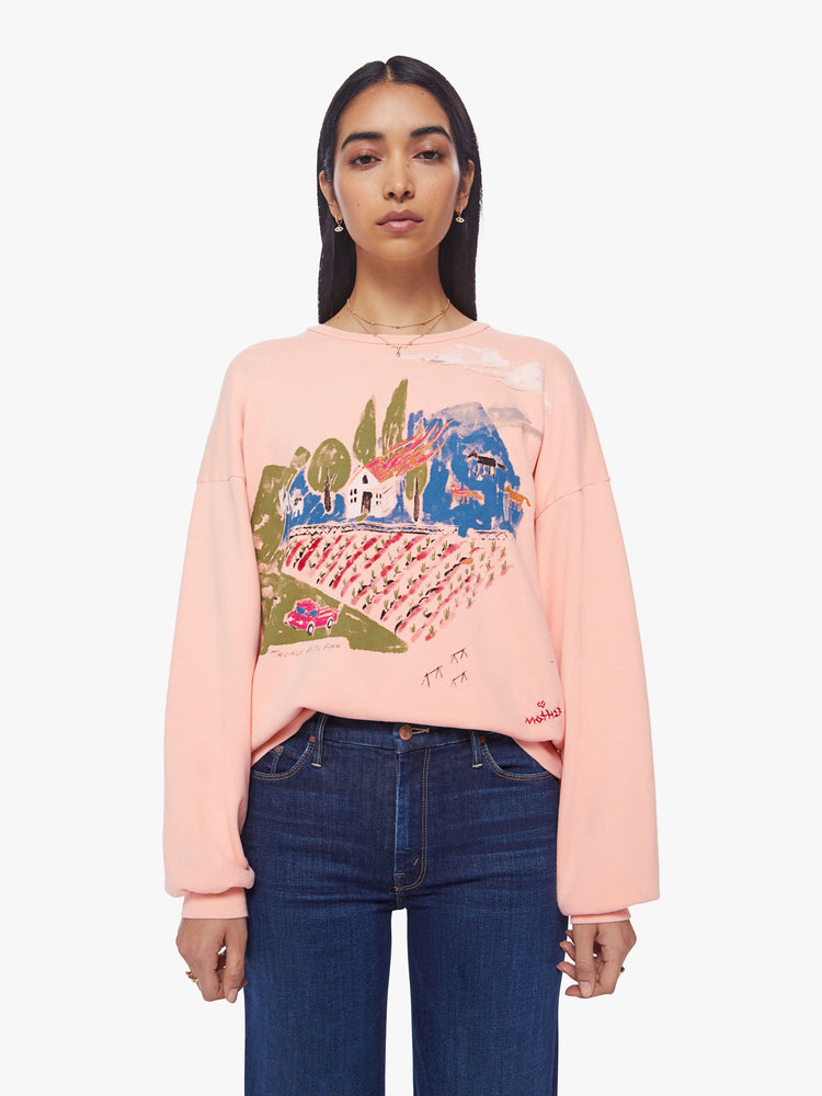 Front view of a woman light pink sweatshirt with dropped sleeves with a hand-drawn doodle of a barn in flames.