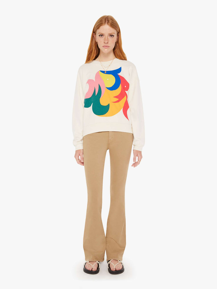 Front full body view of a womens ivory crew neck sweatshirt featuring a large colorful graphic.