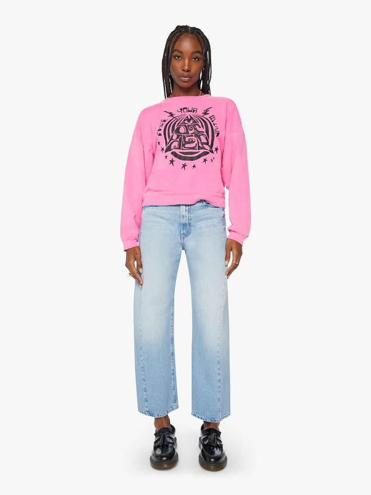 Full body view of a woman crewneck sweatshirt with dropped sleeves in hot pink with black graphic.