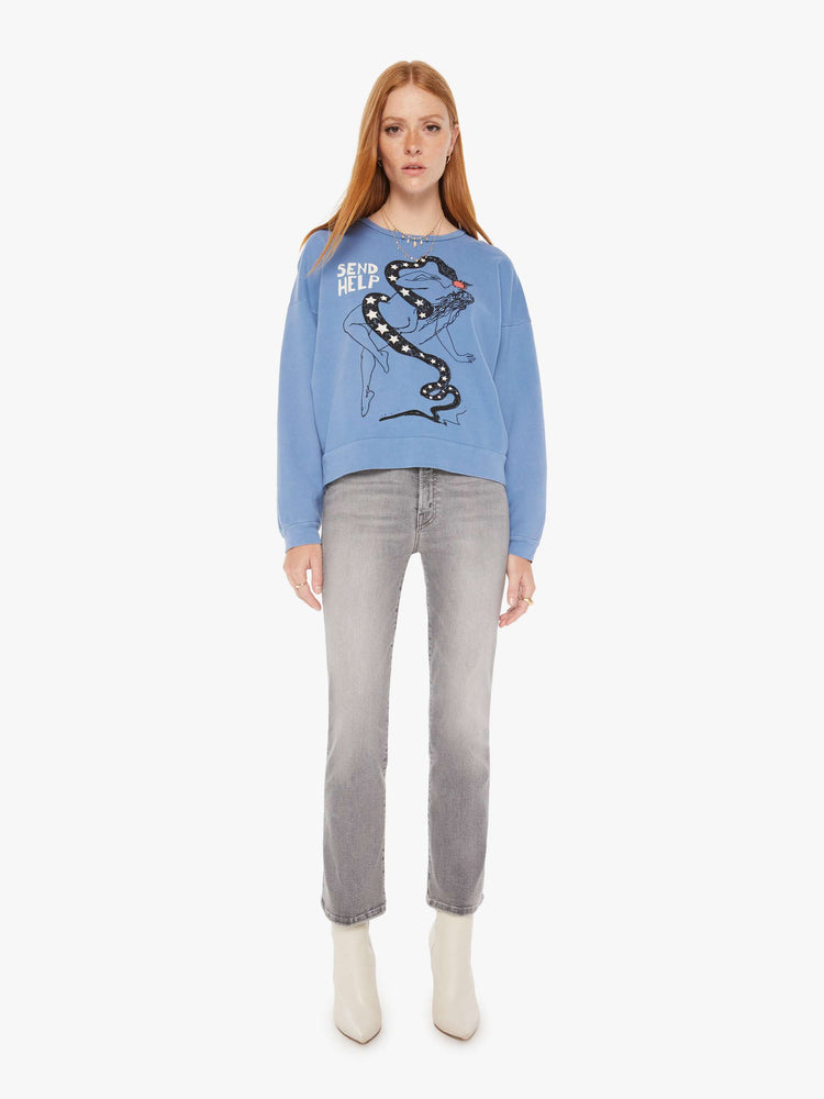 Front full body view of a womens faded blue sweatshirt featuring a woman and snake graphic with the words "SEND HELP".