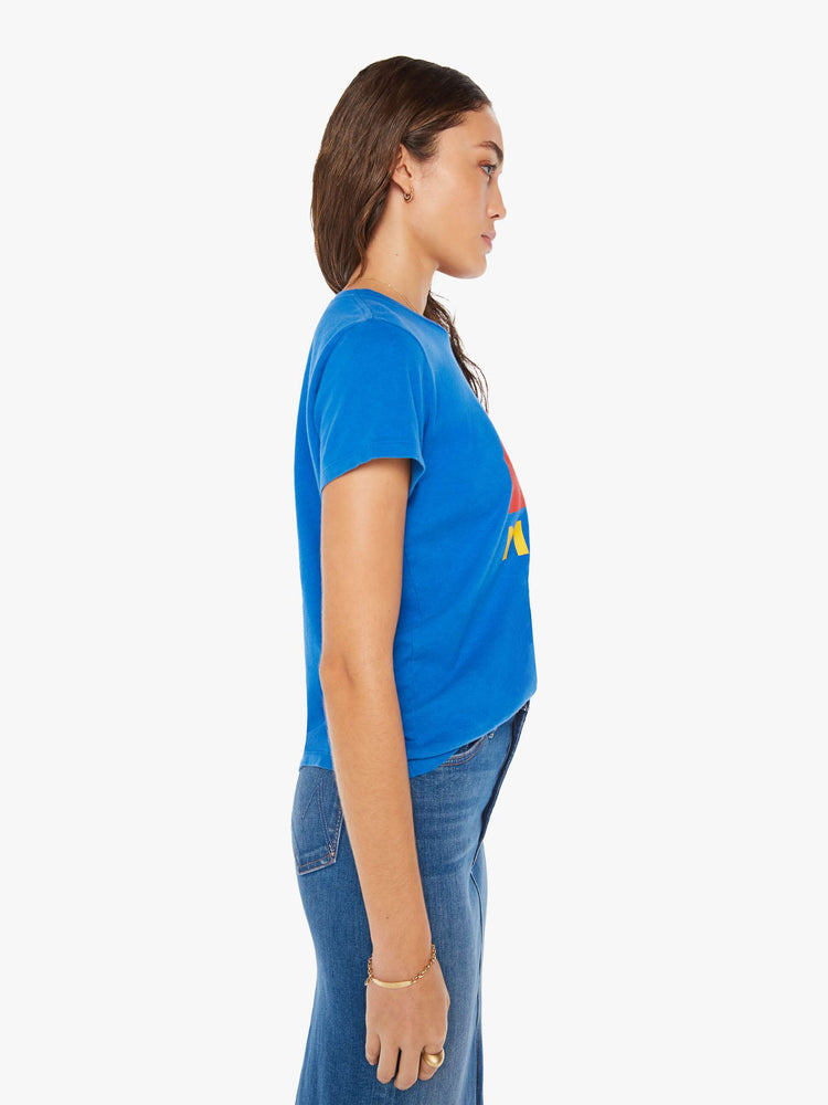 Side view of a woman blue crewneck with a rainbow graphic and mother's name in yellow on front.