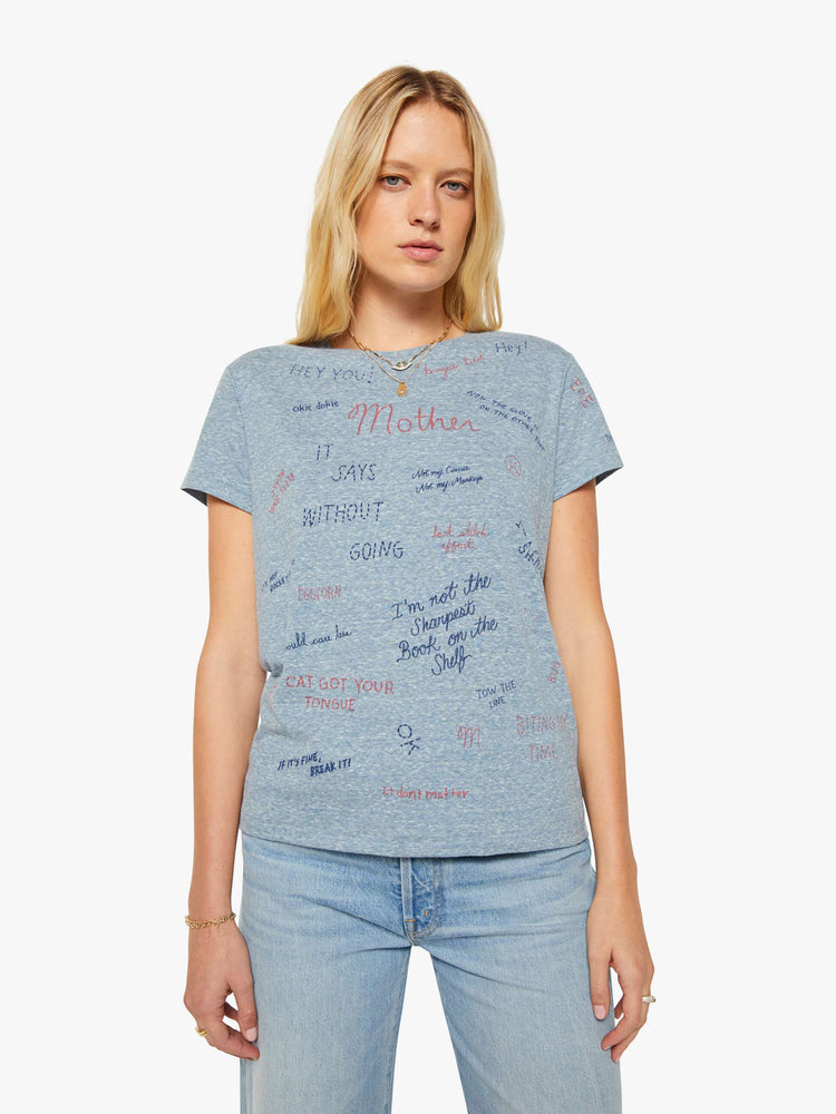 Front view of a woman in an overdyed blue with a printed text tee.