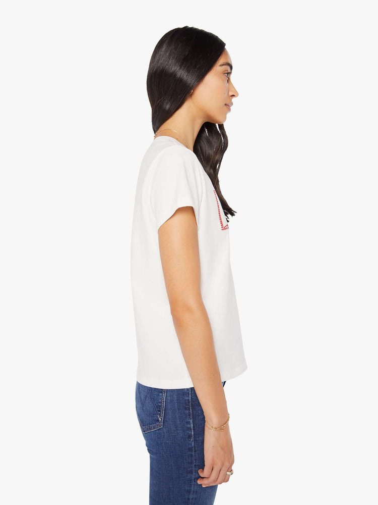 Side view of a woman in a faded red and blue graphic embellished with metallic rhinestones and MOTHER across the front white crewneck tee.