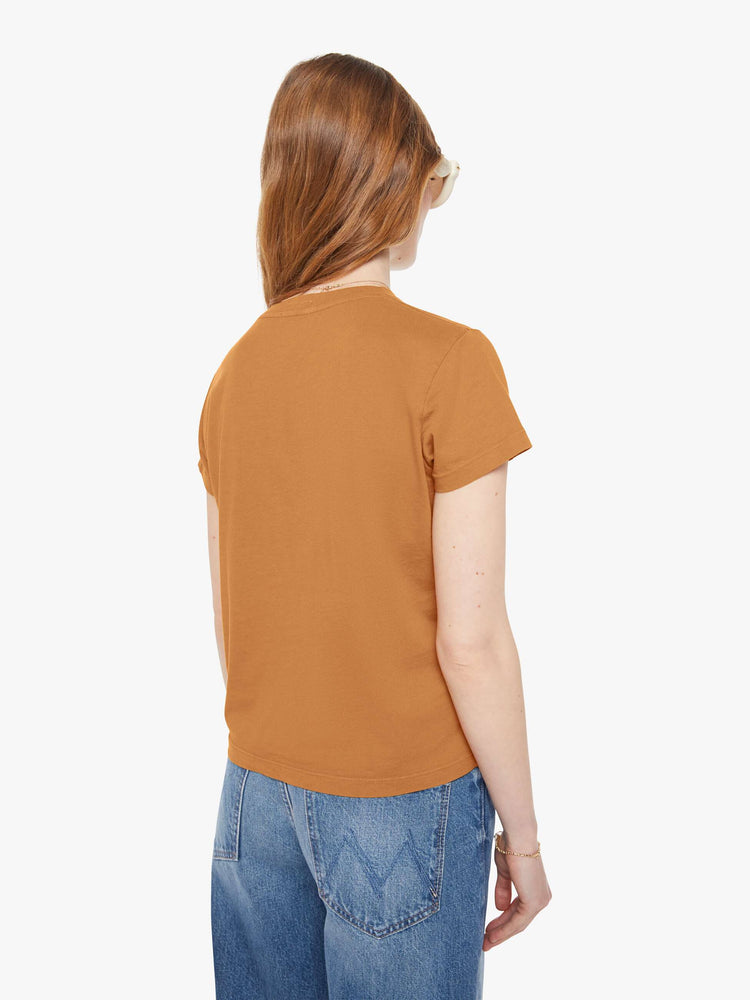 Back view of a woman in a dark khaki tee with cream writing.