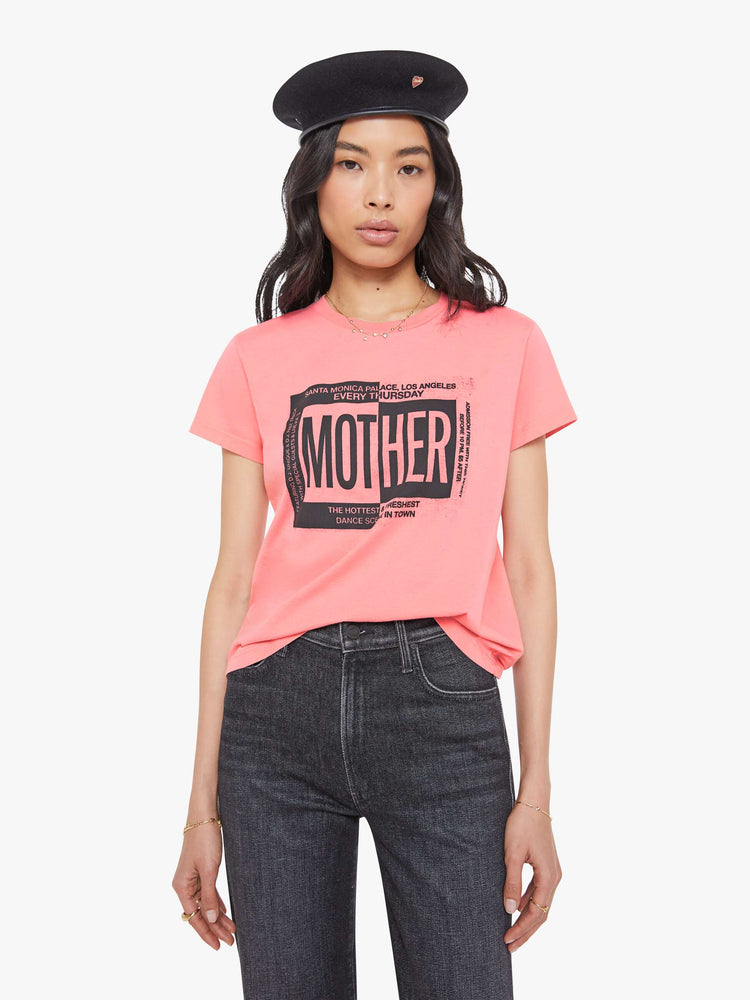 Front view of a woman in a light pink  tee with a ticket-inspired graphic and MOTHER's name in black on the front.