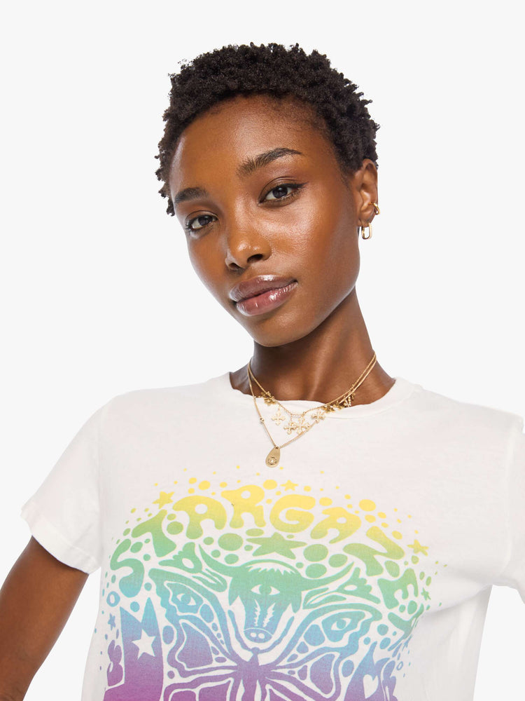 Close up view of a woman bright white with a rainbow celestial graphic across the chest tee.