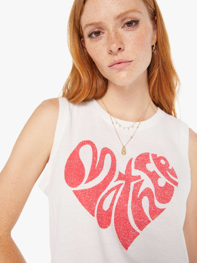 Front close up view of a womens white tank featuring a MOTHER heart graphic in red.