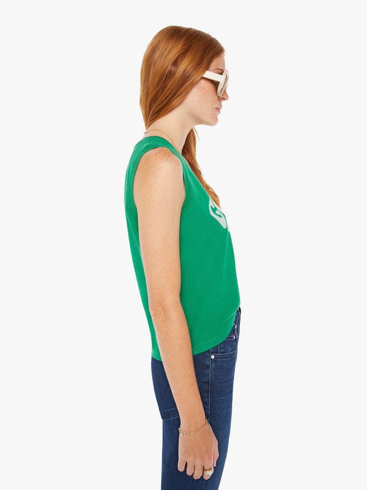 Side view of a woman green cropped muscle tee with a crewneck and boxy fit.
