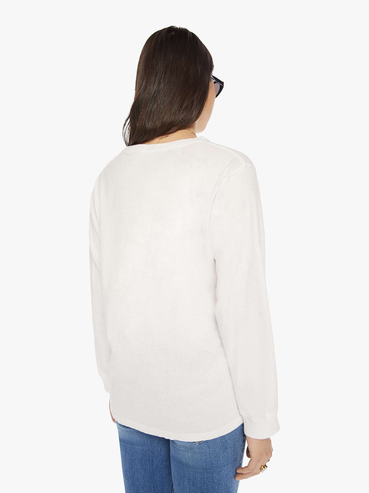 Back  view of a woman crewneck tee with long sleeves and an oversized fit in a bight white hue.