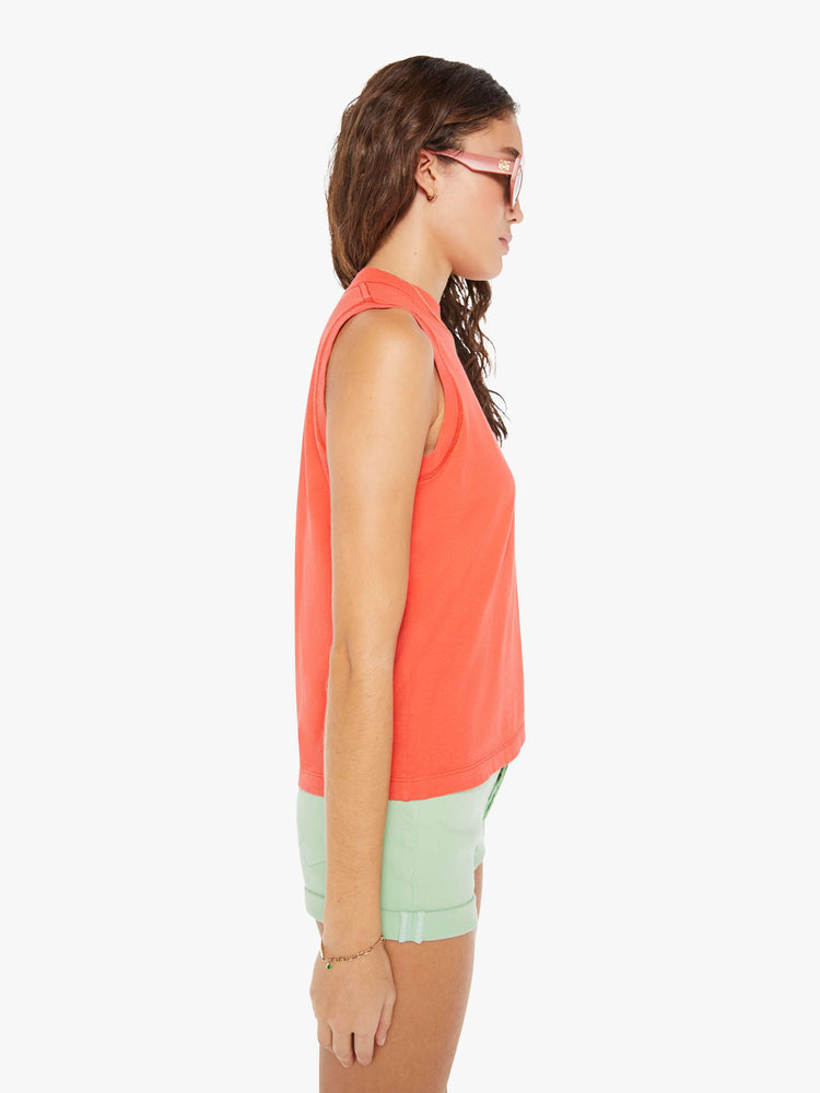 Side view of a woman in a vintage-inspired tank is designed with a crew neck, patch pocket and relaxed fit.