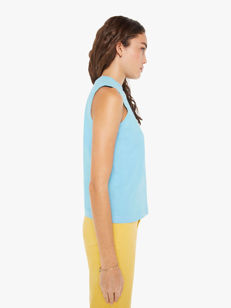 Side view of a woman in a vintage-inspired tank designed with a crew neck, patch pocket and relaxed fit.