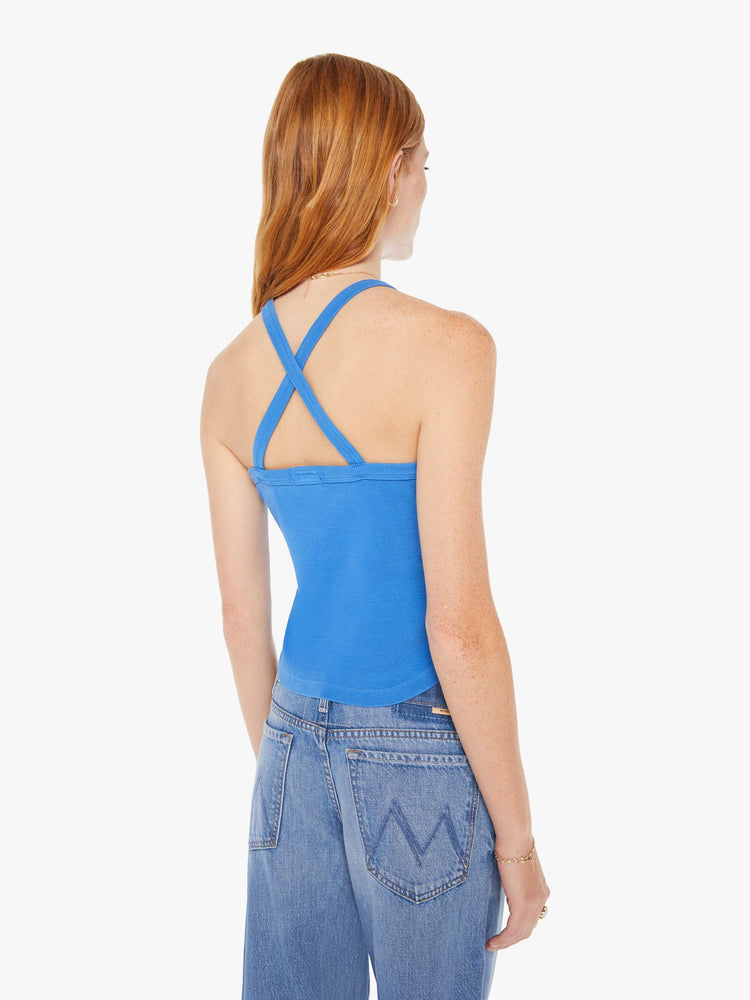 Back view of a woman in a royal blue tank features a slim fit, racer-style straps that cross in the back and a slightly curved hem.