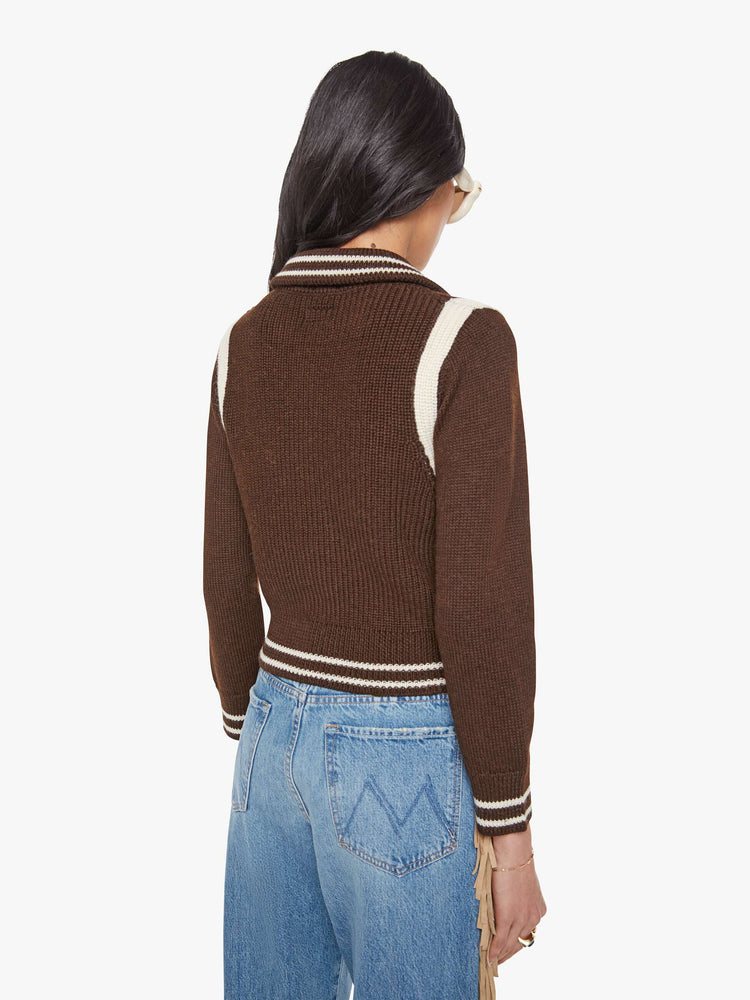 Back view of a chocolate  collared knit top with long sleeves, buttons down the front, ribbed hems and a slightly shrunken fit. 