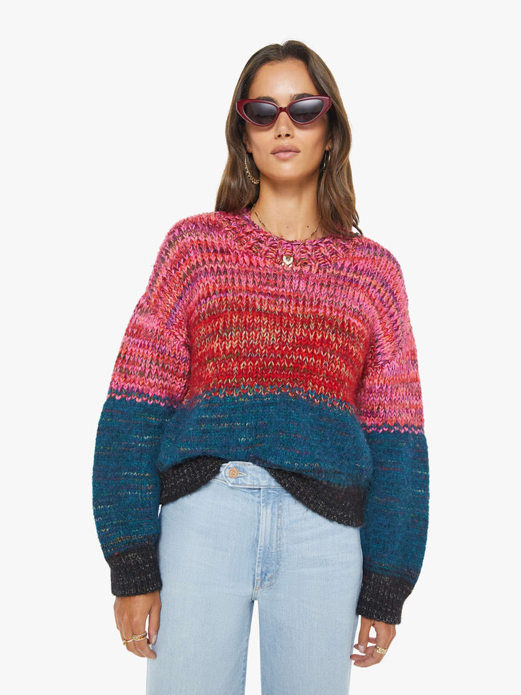 Front view of a woman in multi color  cropped crewneck sweater with drop shoulders, ribbed hems and an oversized fit. 