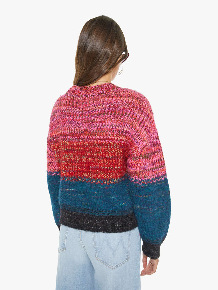 Back view of a woman in multi color  cropped crewneck sweater with drop shoulders, ribbed hems and an oversized fit. 