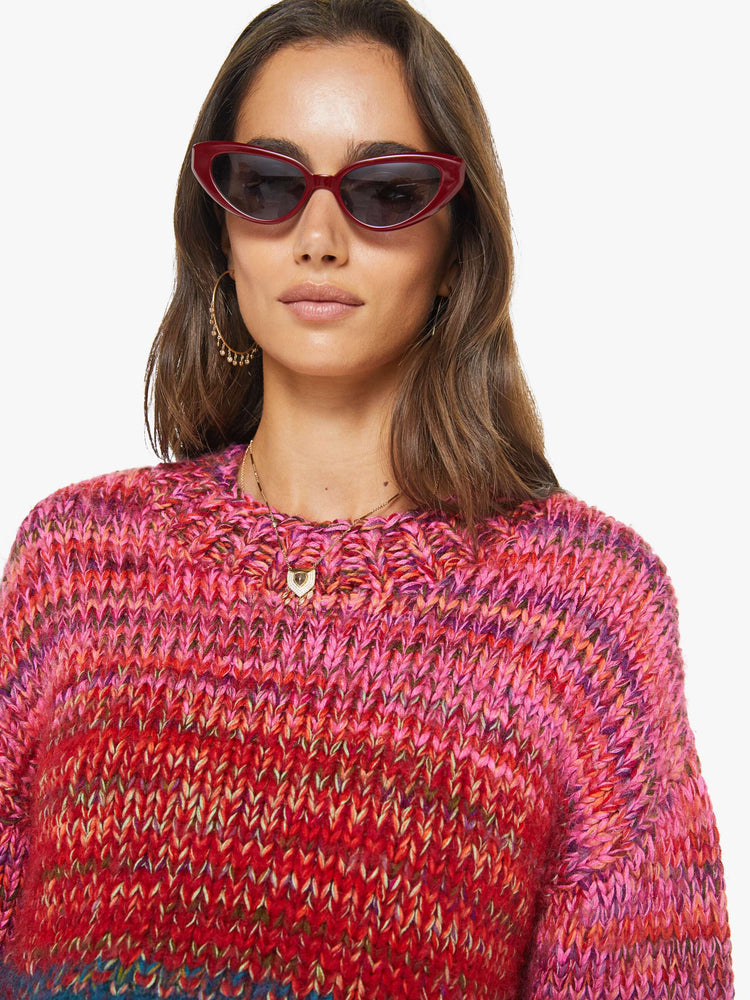Swatch view of a woman in multi color  cropped crewneck sweater with drop shoulders, ribbed hems and an oversized fit. 