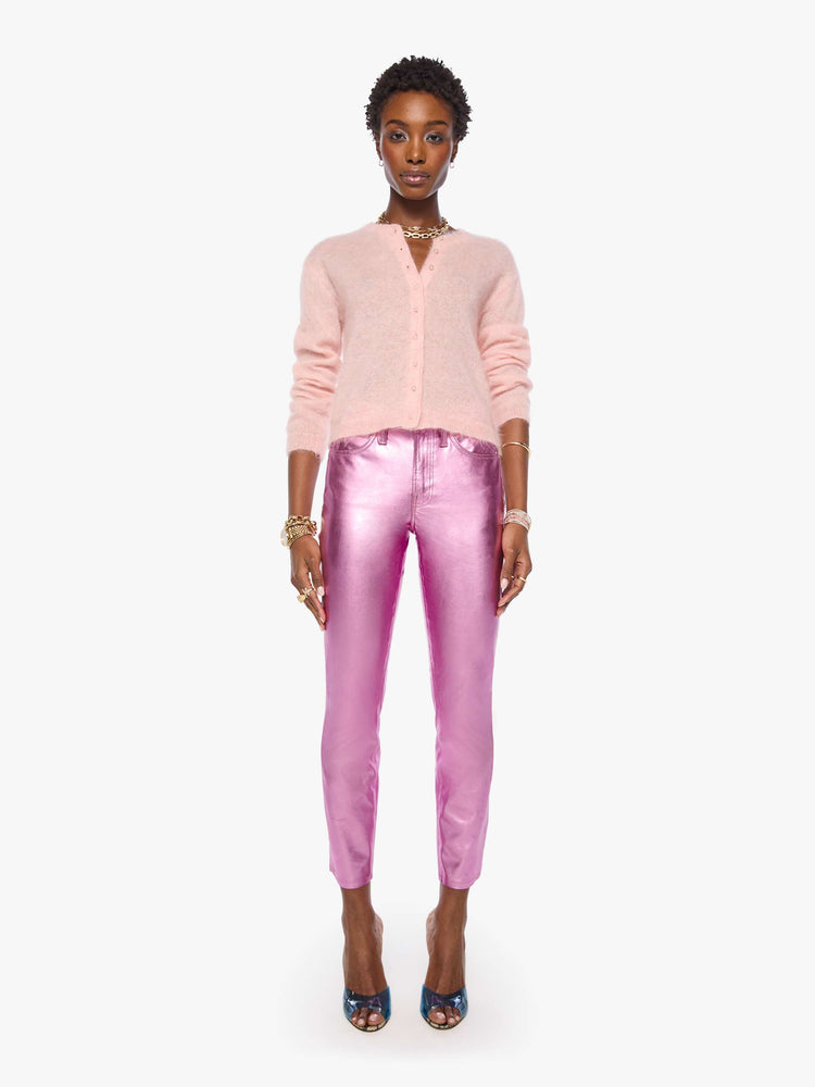 Full body view of a woman in a soft baby pink crewneck, ribbed hems and a cropped fit.