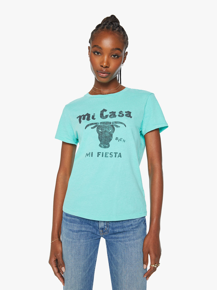 Front view of a woman  aqua blue tee featuring a faded text graphic with a bull on the front.