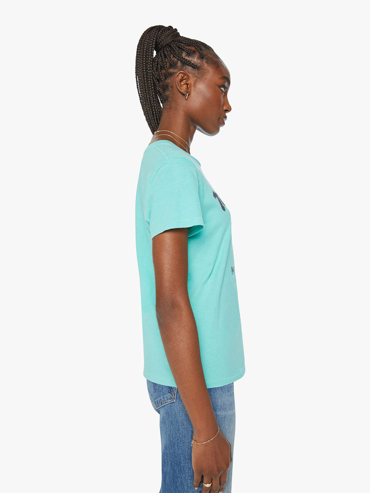 Side view of a woman aqua blue tee featuring a faded text graphic with a bull on the front.