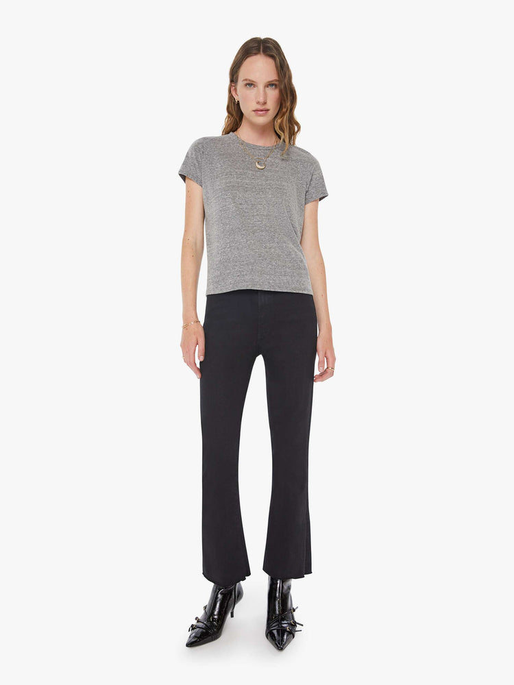 Full body view of a womens heather grey crew neck tee featuring a slim fit.
