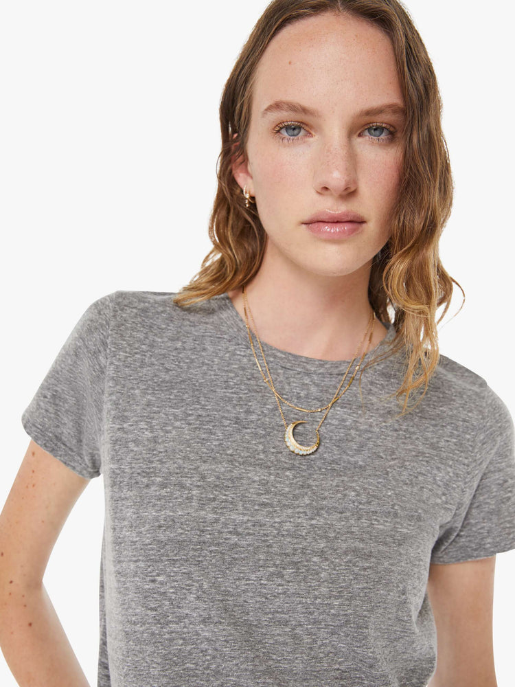Close up view of a womens heather grey crew neck tee featuring a slim fit.