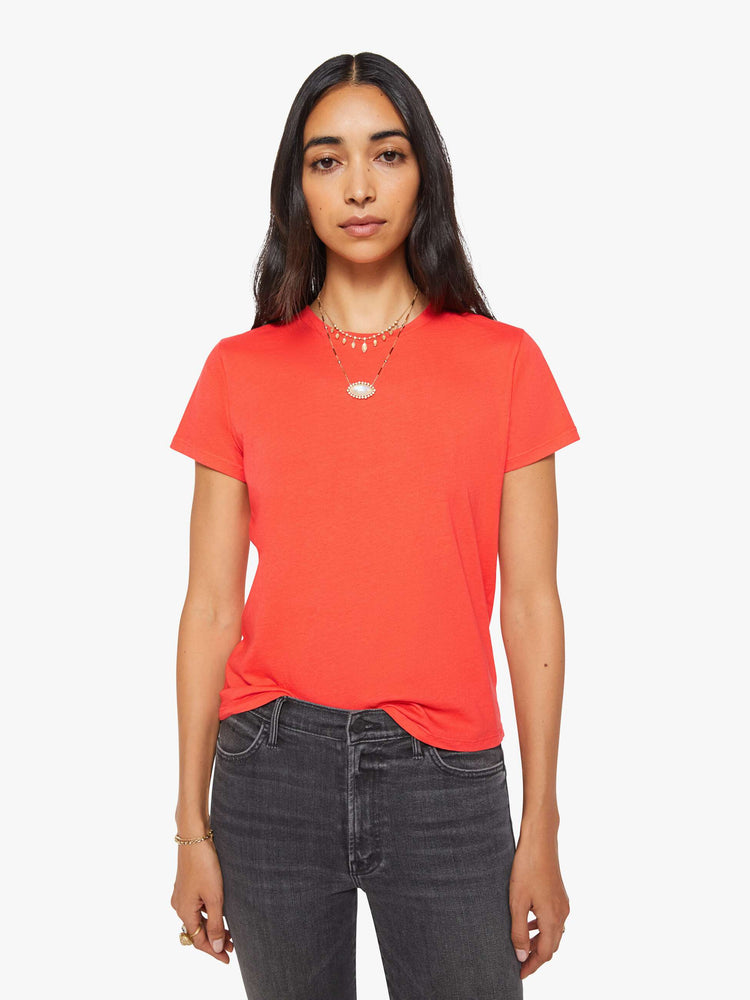 Front view of a woman in a bright orange crewneck with a slim fit for a vintage look and feel.