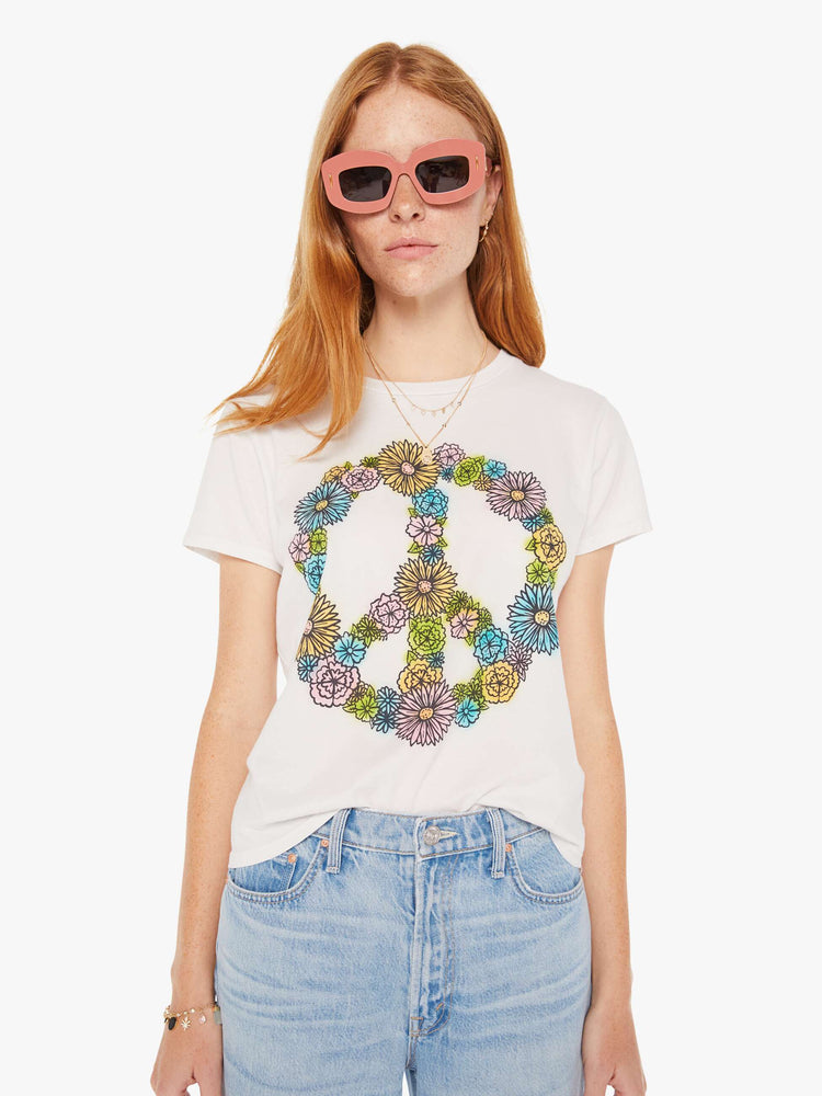 Front view of a white crew neck tee featuring a peace sign made of flowers.