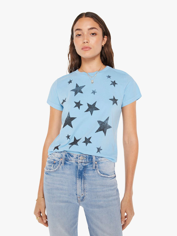 Front view of a woman crewneck in baby blue with faded black stars throughout.