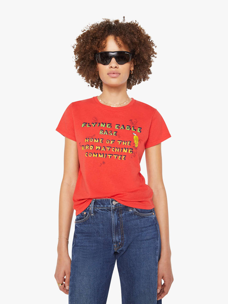 Front view of a woman in a red tee features block text on the front and back.