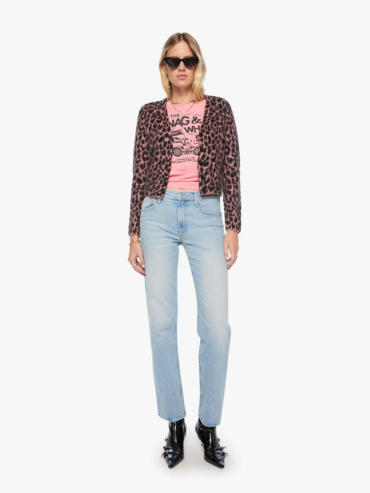 Full body view of a woman in a pink and black cheetah print with a brushed finish V-neck cardigan with a cropped hem and buttons down the front.