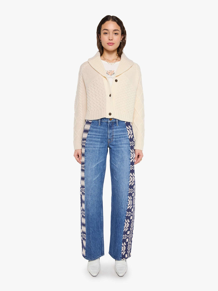Full body view of a woman in a chunky cardigan with a shawl collar, V-neck, 3-button closure, ribbed hems and a slightly cropped fit. 