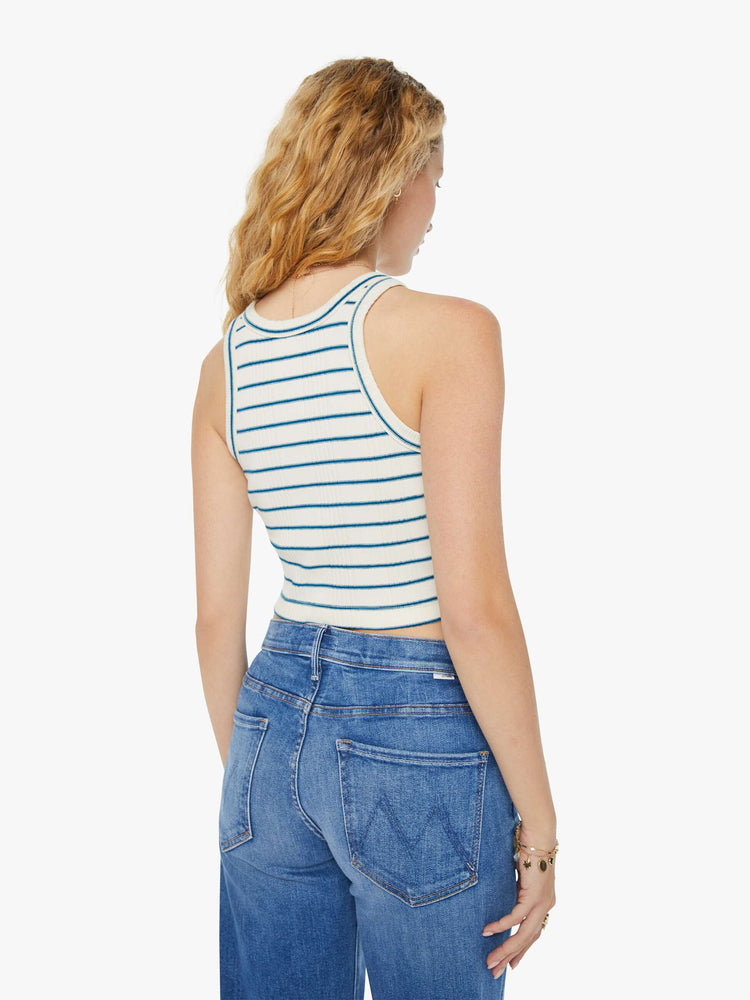 Back view of a woman in a ribbed off-white with blue stripes tank top that features a slim fit, racer-style straps and a clean hem.