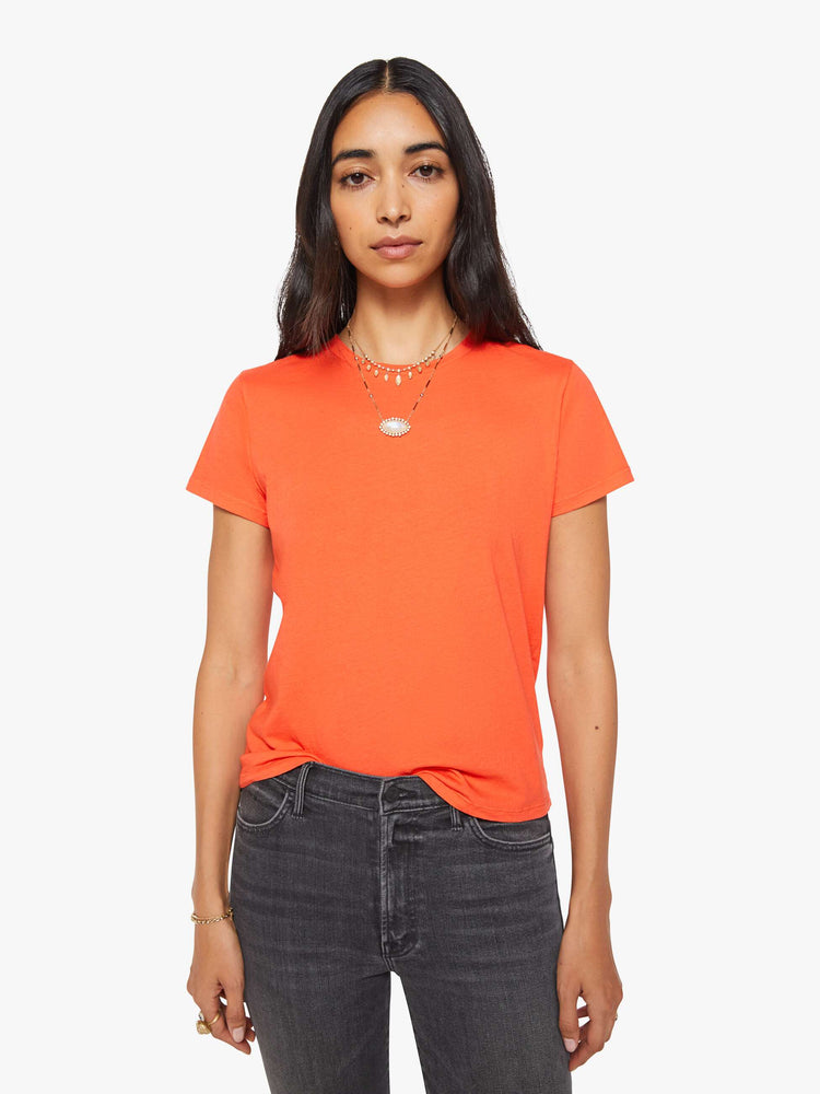 Front view of a woman in a bright orange crewneck with a slim fit for a vintage look and feel.