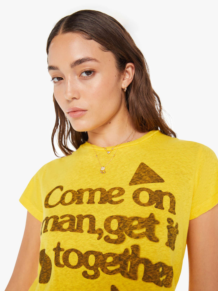 Close up view of a woman in yellow crewneck with a slim fit for a vintage look with shapes on the front.