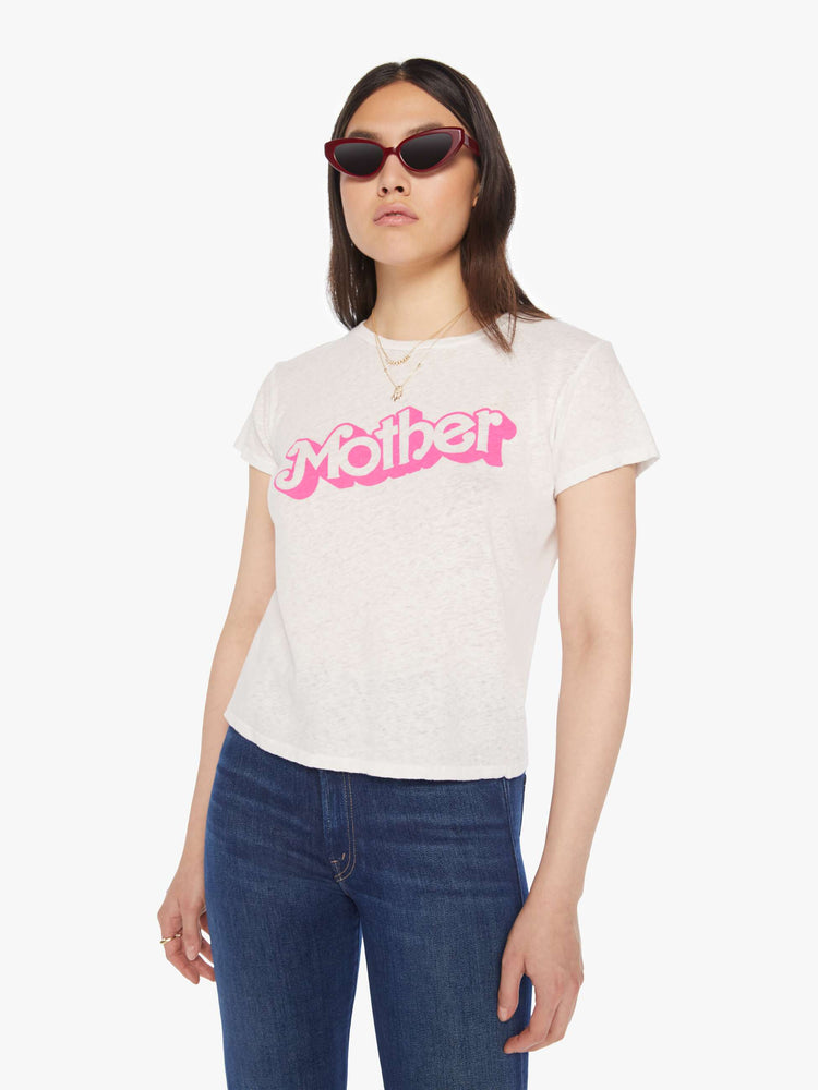 Front view of a woman white soft crewneck with a slim fit in white with the words MOTHER in pink.