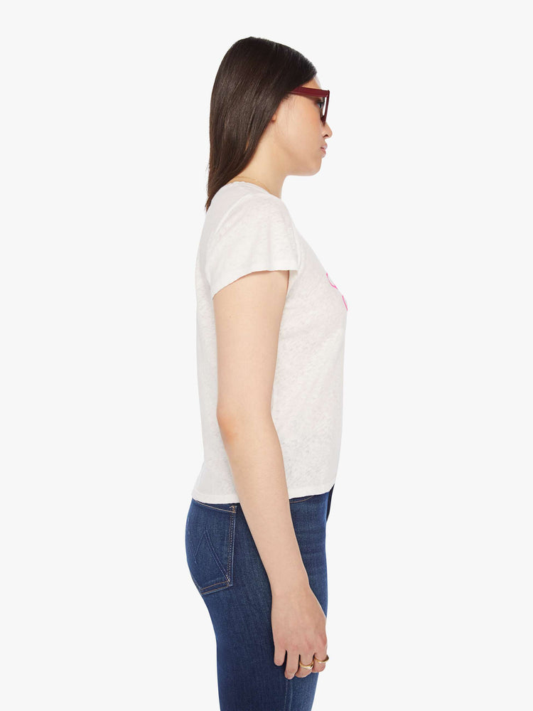 Side view of a woman white soft crewneck with a slim fit in white with the words MOTHER in pink.