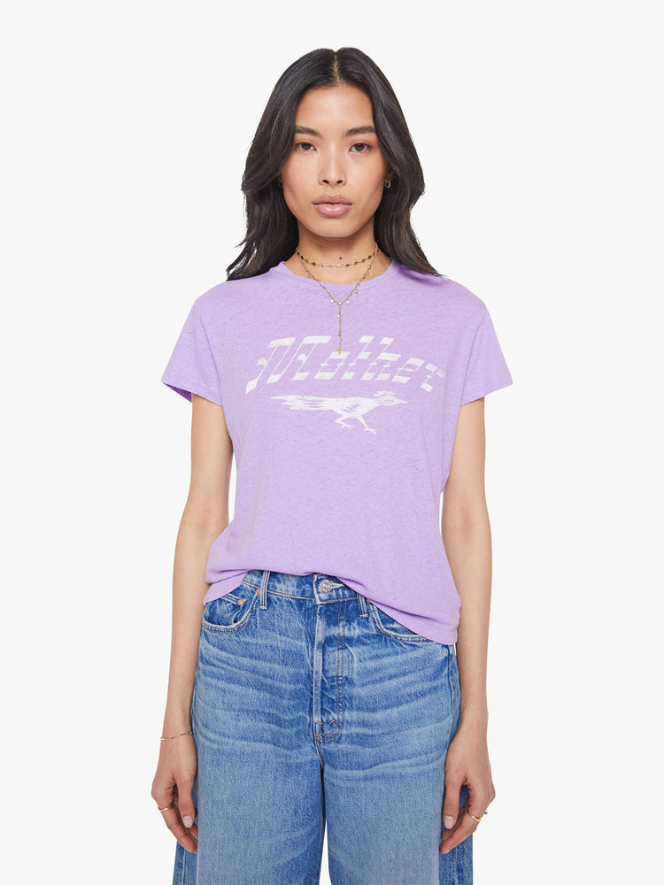 Front view of a woman in a slim fit lavender tee with white faded graphic.