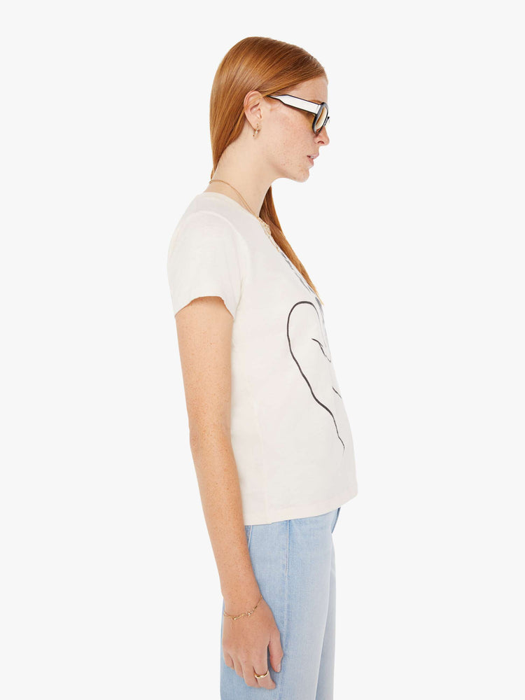 Side view of a womens white crew neck tee featuring a large black graphic.